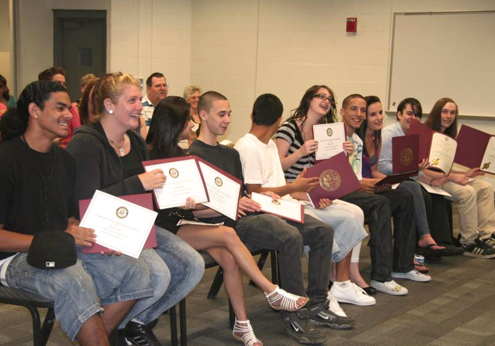 group of young adults get certificates