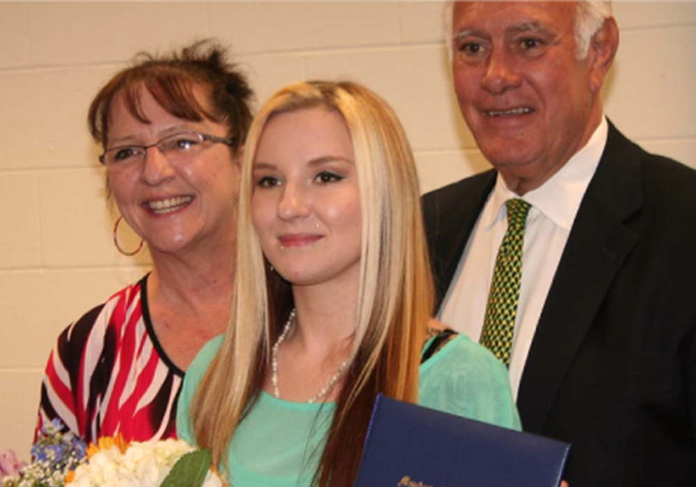 girl receives diploma